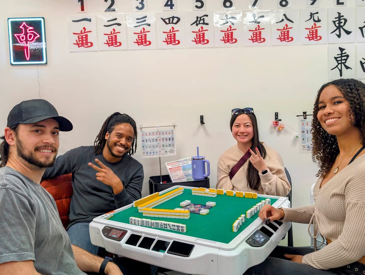 Mahjong tables at Setting Sun Virginia Beach gaming parlor — automated tile shuffler tables for competitive play